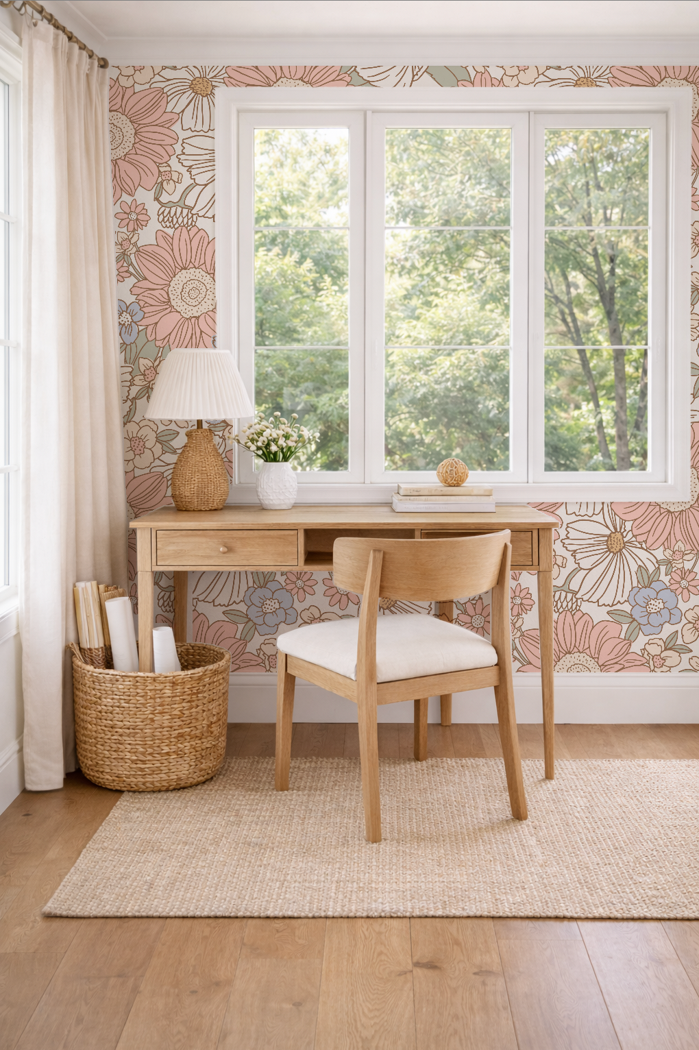 Home office with wooden desk, chair, and floral wallpaper.