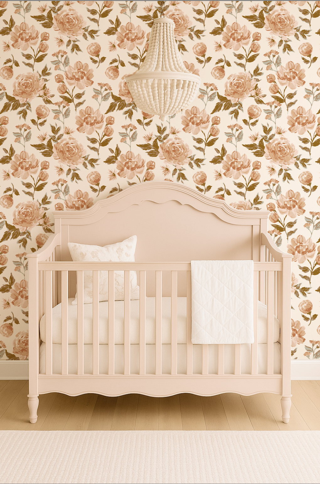 Beige crib with white bedding against floral wallpaper