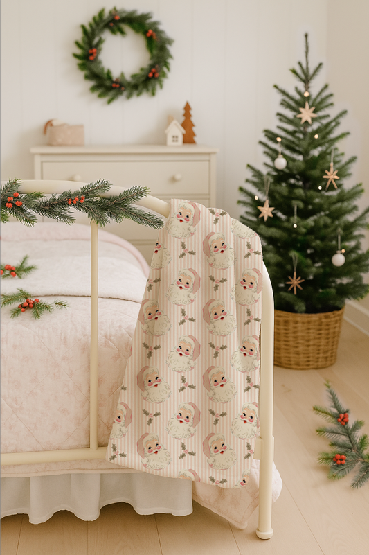 Christmas styled room with minky blanket draped over ivory cottage iron bedframe.