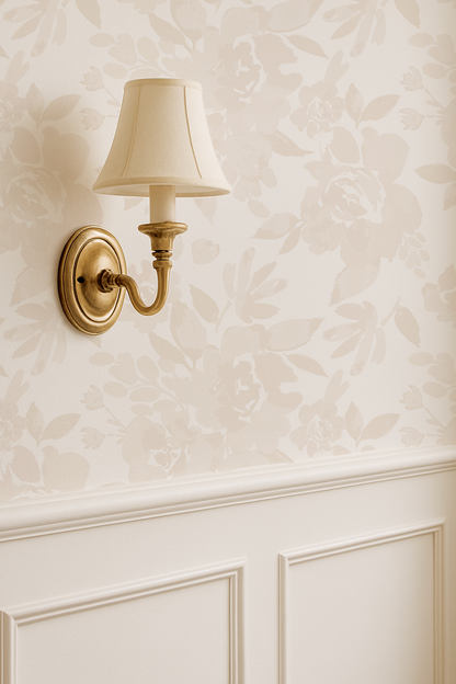 Wall-mounted lamp with a white shade on a textured wall.