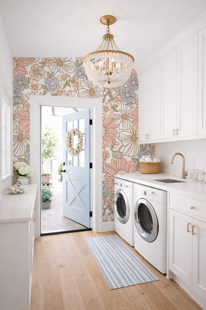 Modern laundry room with floral wallpaper, washer, dryer, and decorative elements.