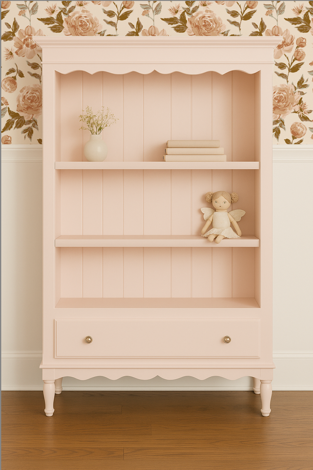 Light pink bookshelf with decorative items against a floral wallpapered wall.