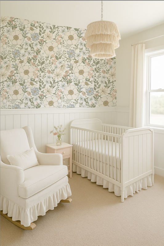Nursery room with white crib, armchair, and floral wallpaper.
