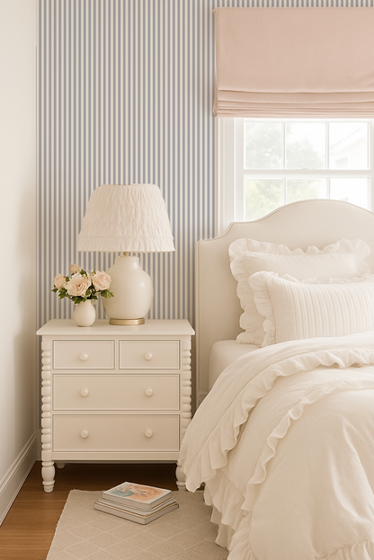 Elegant blue grey stripe wallpaper in cozy bedroom with white furniture.