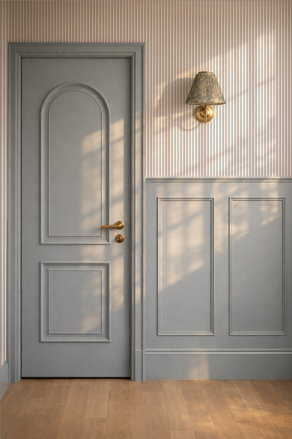 Elegant blue-grey striped wallpaper in a modern room with paneled door and wall lamp.
