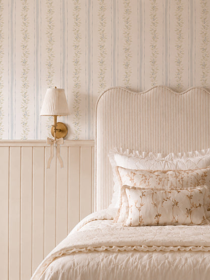 Cream bedroom with Blueberry Vines wallpaper featuring sage and gold vines on cream background.