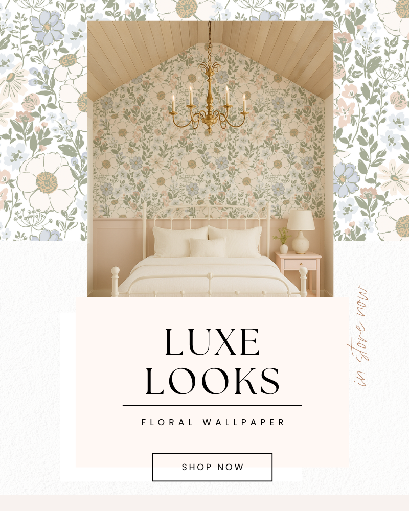 Bedroom with floral wallpaper and chandelier, promoting 'Luxe Looks' floral wallpaper.