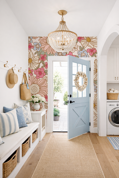 Narrow hallway with floral wallpaper, a blue door, and laundry room.