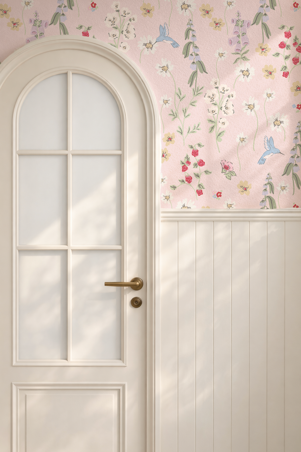 Hummingbird and floral wallpaper on blush backdrop in a cozy room with arched door.