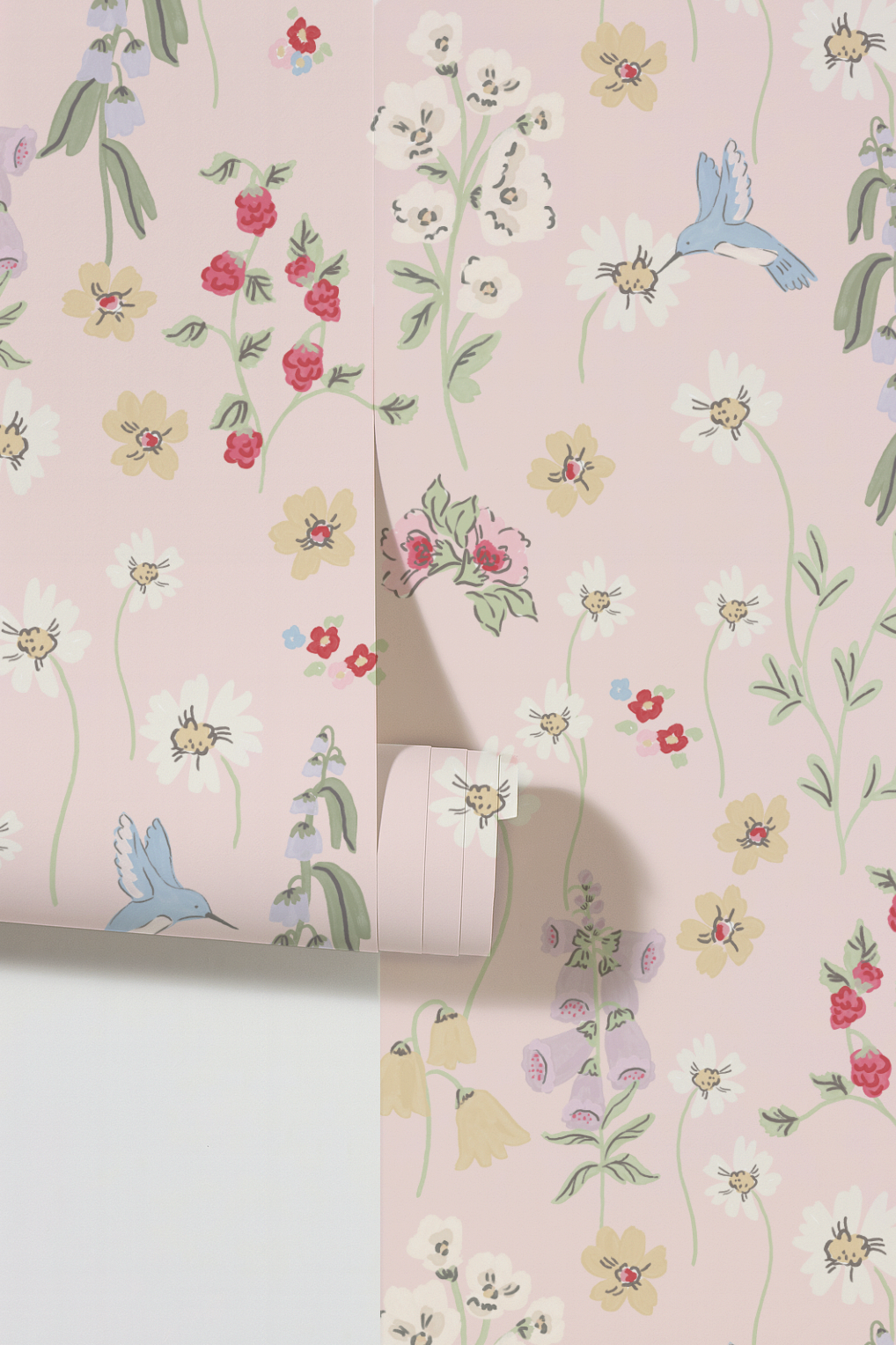 Hummingbird and floral pattern wallpaper on blush background.