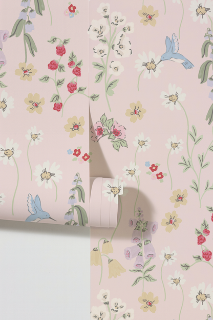 Hummingbird and floral pattern wallpaper on blush background.