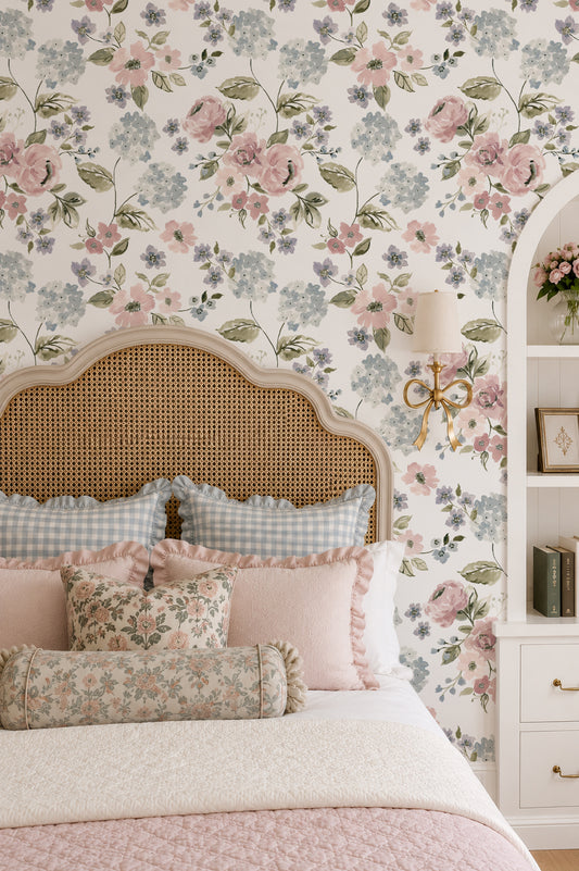 Hydrangea garden blossoms wallpaper in pink and blue in vintage bedroom setting.