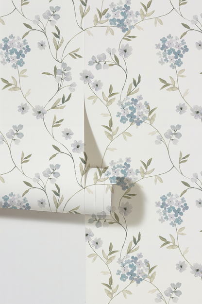 Lavender hydrangea floral wallpaper with delicate foliage on a white background.